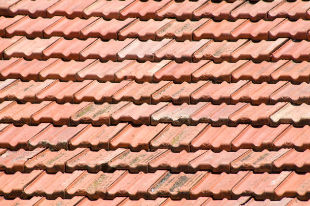 istock Old roof with ceramic tiles closeup 859434608