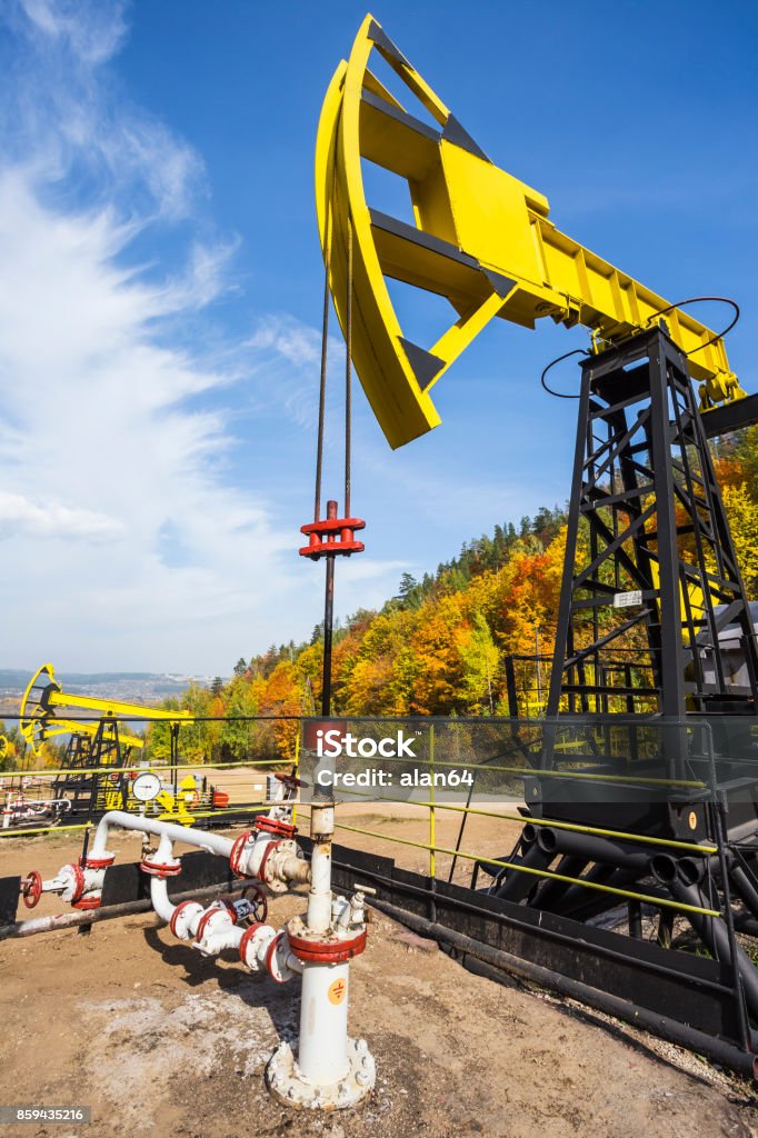 Oil Pump Oil Pump on a background of forest in Russia Air Pollution Stock Photo