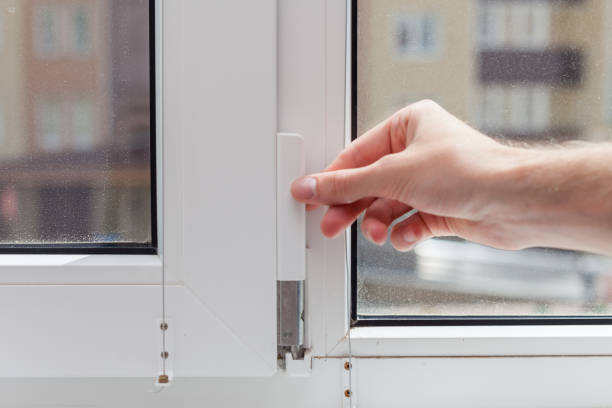 istock The worker removes the protective plug from the element of the plastic window. Preparing a plastic window for minor repairs 859438568