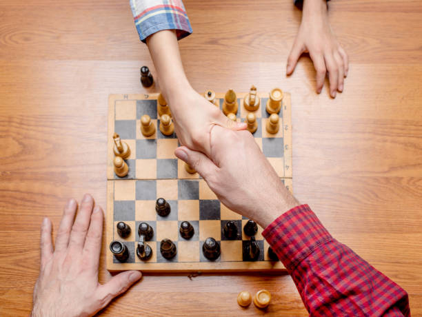 istock Family playing chess 859441560