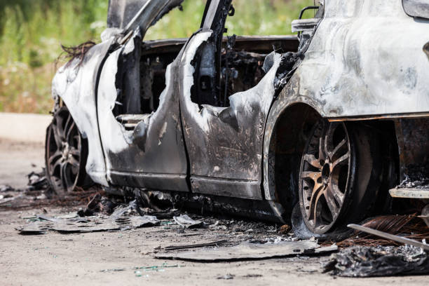 istock Arson fire burnt wheel car vehicle junk 859444596