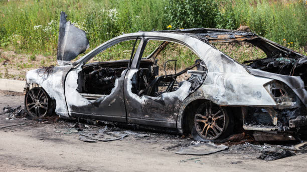 istock Arson fire burnt wheel car vehicle junk 859444790