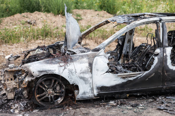 istock Arson fire burnt wheel car vehicle junk 859445086