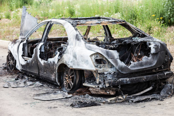 istock Arson fire burnt wheel car vehicle junk 859445232