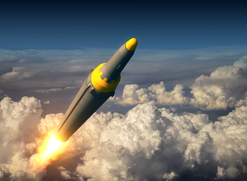 North Korean Ballistic Rocket Over The Clouds. 3D Illustration.