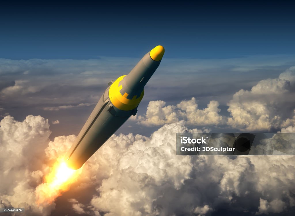 North Korean Ballistic Rocket Over The Clouds North Korean Ballistic Rocket Over The Clouds. 3D Illustration. Missile Stock Photo