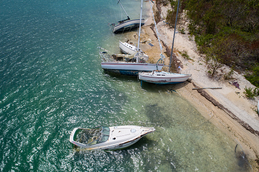 Aerial drone shot of sail boats washed ashore on Wisteria Island Key West FL USA Hurricane Irma
