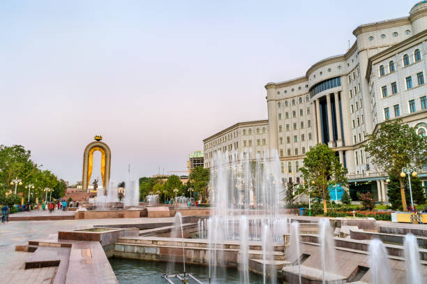 fountain and the national library in dushanbe, the capital of tajikistan - tajik flag imagens e fotografias de stock