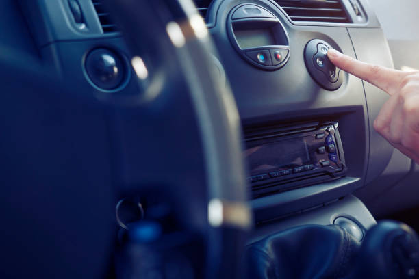istock The passenger in the car presses the button climate control. 859455542