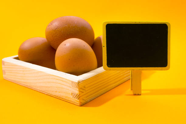 Blank price board with Fresh Eggs in wooden box