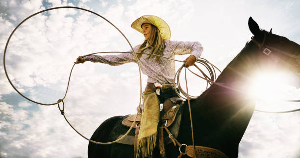 cowgirl roping - rodeo lasso cowboy horse stock-fotos und bilder