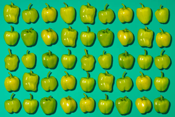 istock Green Bell Peppers on green background. 859459534