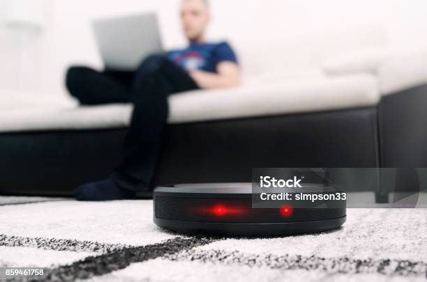 Robotic Vacuum Cleaner On Carpet Stock Photo - Download Image Now - Vacuum Cleaner, Robot, Intelligence