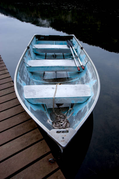 istock Fine art image of rowboat by dock. 859462228