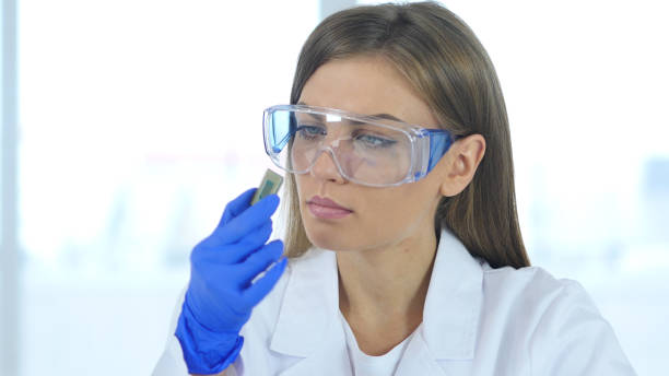 istock Female Scientist Examining New Chip of Computer 859466666