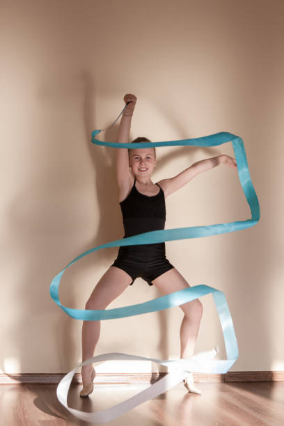 istock Rhythmic gymnastics. Strong confident ballerina 859469138
