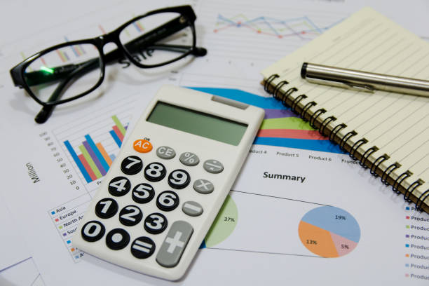 istock Office Concepts : data analyzing with calculator,glasses,notebook and pen. on charts and graph to find out the result. 859474778