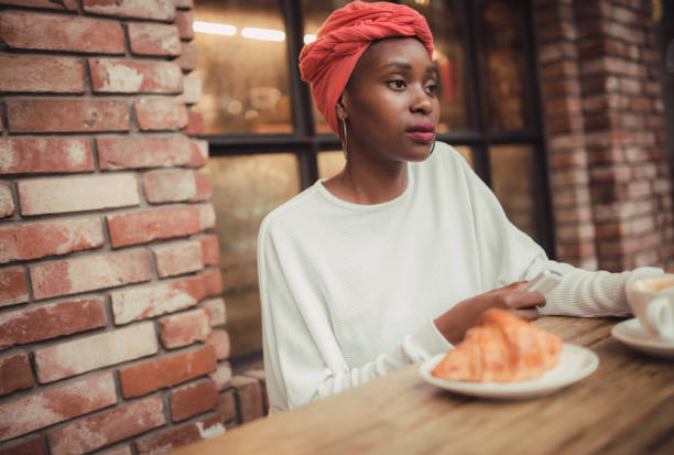 istock Black woman in cafe 859478922