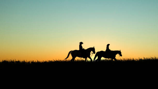 istock Horseback Riders at Sunset 859479012