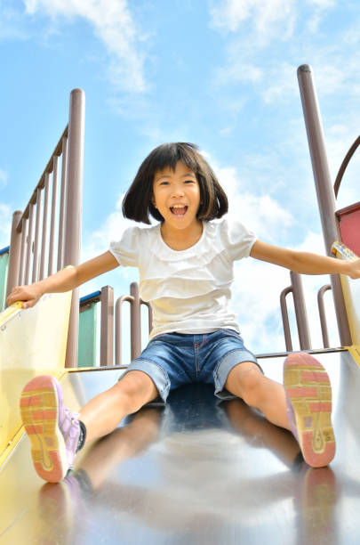 istock Girls playing in the park 859485734