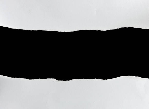 istock ripped paper on black background 859486278