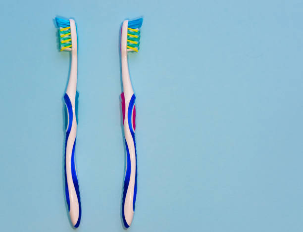 istock Two toothbrushes. Morning hygiene. The concept of a married couple 859488708