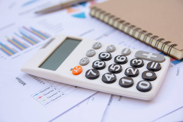 istock Office Concepts : data analyzing with calculator,notebook and pen. on charts and graph to find out the result. 859488944