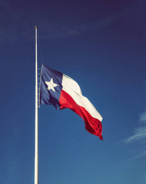 istock State flag of Texas flying at half-mast 859492566