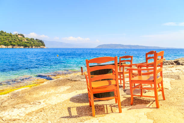 istock Table and chairs next to the beach, Greece 859494052