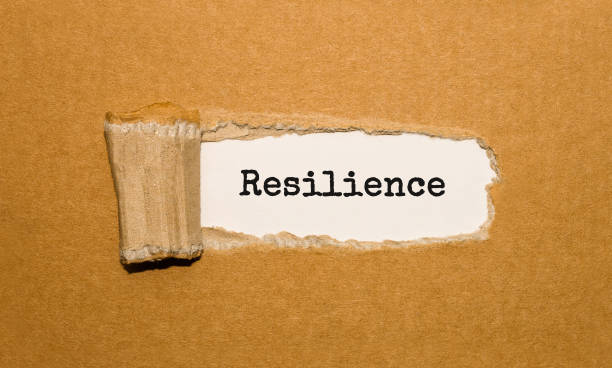istock The text Resilience appearing behind torn brown paper 859494632