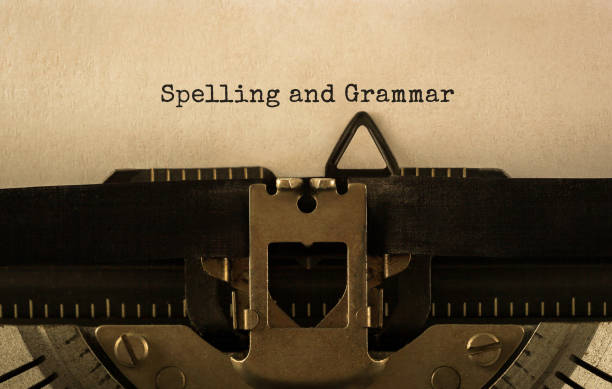 text spelling and grammar typed on retro typewriter - proofreading reading and writing writing exam imagens e fotografias de stock