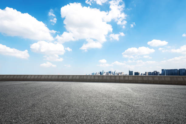 istock empty asphalt road with cityscape of modern city 859497888