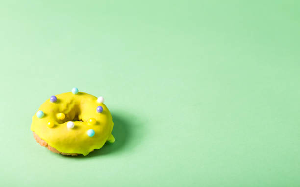 istock Colorful glazed donuts on a bright background 859500458