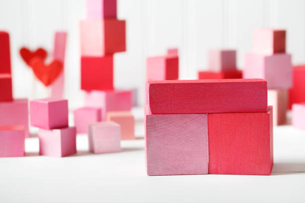 istock Red and pink wooden blocks with small hearts 859500680