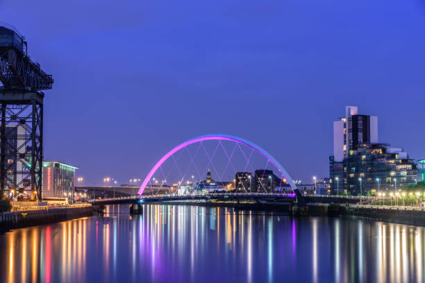 Night lights reflection of Glasgow Glasgow, Scotland - August 15, 2017: Night lights and the Clyde Arc Bridge at Glasgow City in Scotland over river. itv photos stock pictures, royalty-free photos & images