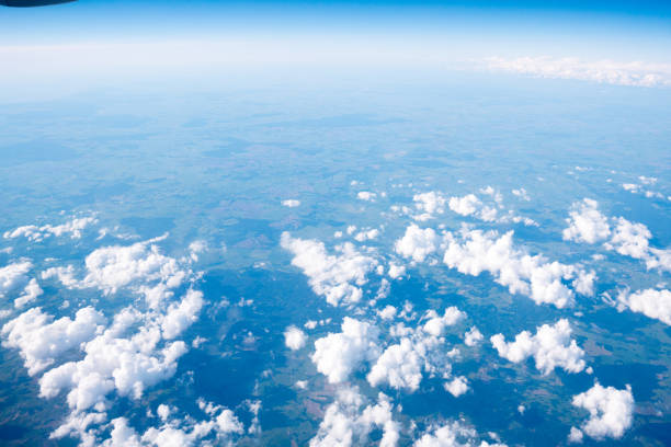 istock Clouds and sky sunny day through airplane window 859510368