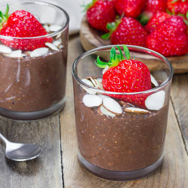 istock Chocolate chia seed pudding garnished with almond slices and strawberry, square format 859510540