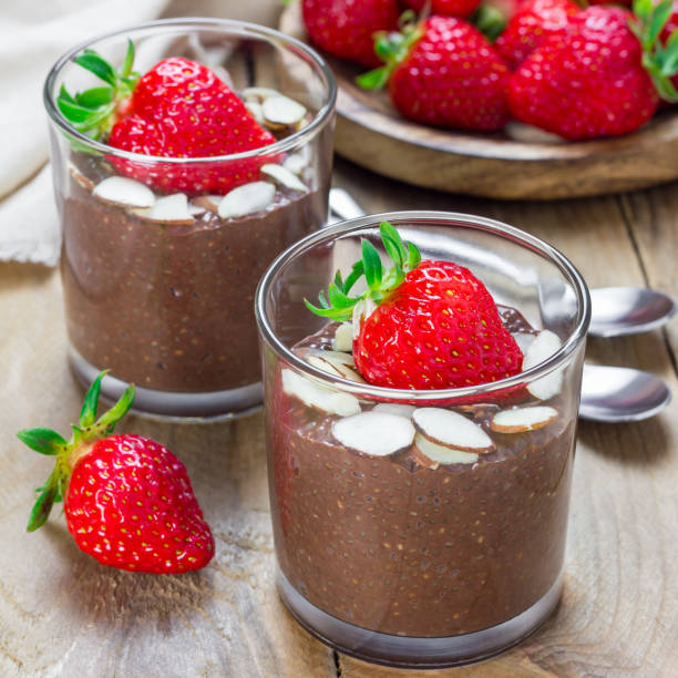 istock Chocolate chia seed pudding garnished with almond slices and strawberry, square format 859510544