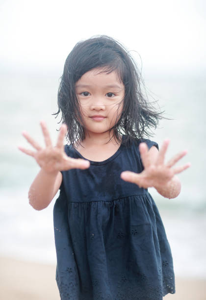istock Children playing on the beach 859514584