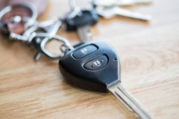 istock Close up of car key on wood table 859515008