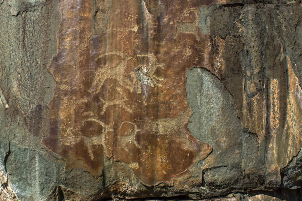 Petroglyphs of Altay. Ancient rock paintings in the Altai Mountains. Petroglyphs of Altay. Ancient rock paintings in the Altai Mountains. çatalhöyük stock pictures, royalty-free photos & images