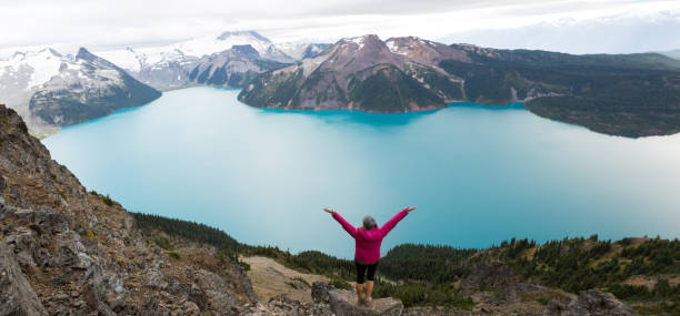 istock Female hiker embraces nature 859529842