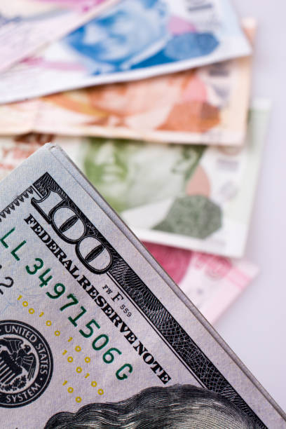 istock American dollar banknotes and Turksh Lira banknotes side by side 859532366