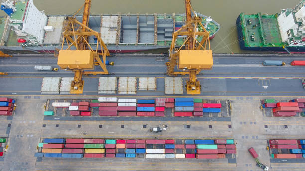 istock Logistics and transportation of Container Cargo ship and Cargo working crane bridge in shipyard 859533752