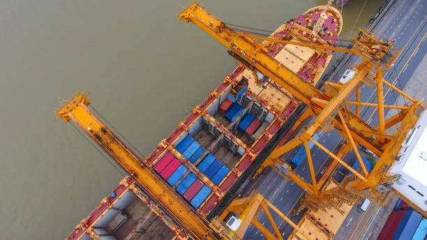 istock Logistics and transportation of Container Cargo ship and Cargo working crane bridge in shipyard 859533796
