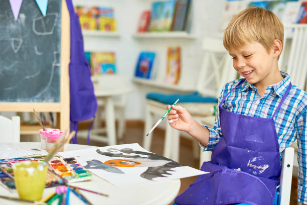 istock Blonde Little Boy in Art Studio 859536122