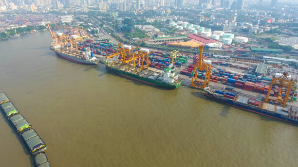 istock Logistics and transportation of Container Cargo ship and Cargo working crane bridge in shipyard 859536736