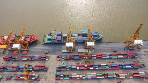 istock Logistics and transportation of Container Cargo ship and Cargo working crane bridge in shipyard 859536748