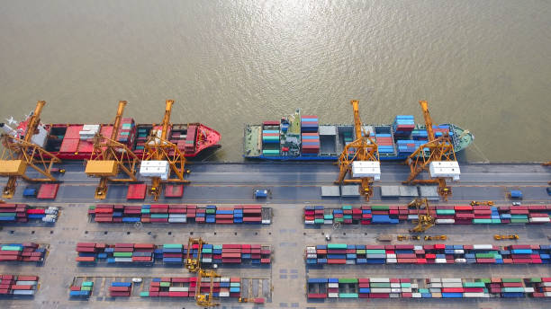 istock Logistics and transportation of Container Cargo ship and Cargo working crane bridge in shipyard 859536958