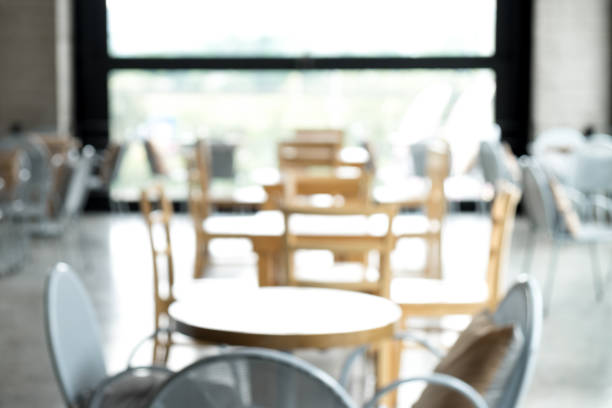 istock Blurred abstract coffee shop or cafe restaurant with bokeh light image background, tables and chair in coffee shop, For your montage product display 859540822